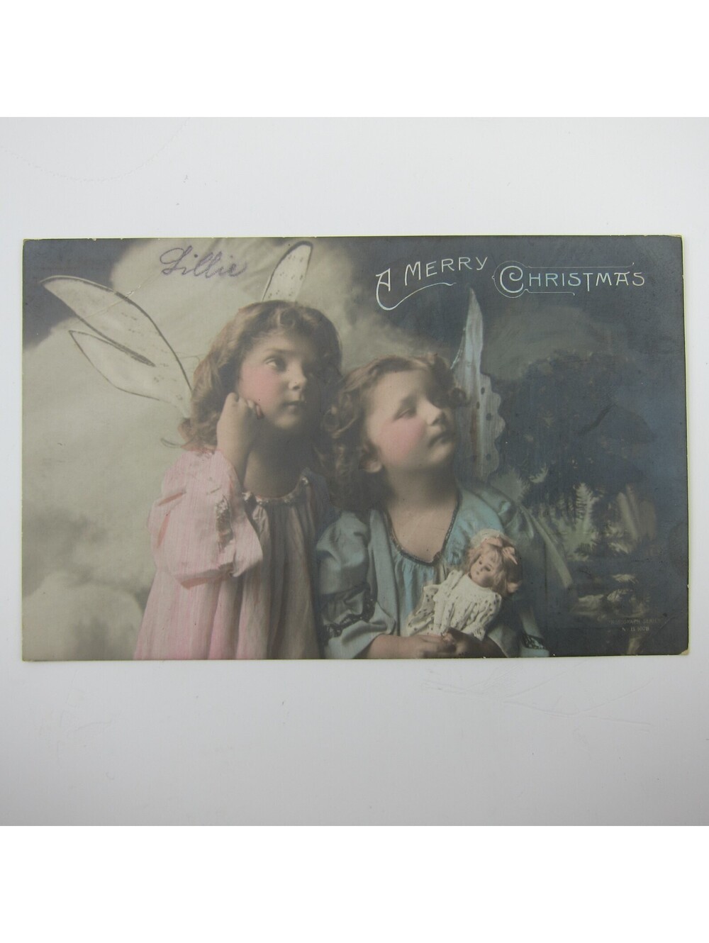 Christmas Postcard Girls Dressed Angel Wings Hold Doll Rotograph Co Antique 1911